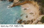 Woman standing on rock in a secluded cove in Kefalonia during summer travel. Стоковое видео, видеограф Ольга Сухарева / Фотобанк Лори