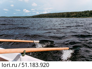 Karelia, Russia, 9 June 2019, Tourists sail on wooden paddle boat on Lake Ladoga. Стоковое фото, фотограф Spirit River / Фотобанк Лори