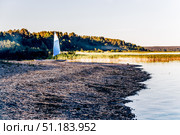 Kayak canoe with sail is moored on shore of Lake pond Ladoga in Karelia, Russia. Стоковое фото, фотограф Spirit River / Фотобанк Лори