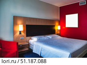 Inviting Hotel Room Displaying Modern Design and Comfortable Living. Стоковое фото, фотограф Aleksandr Golubev / Фотобанк Лори