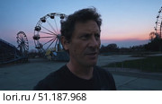 Wander through a deserted amusement park during dusk, revealing rusty rides and a mysterious atmosphere illuminating the surroundings. Стоковое AI-видео, аниматор Данила Большаков / Фотобанк Лори