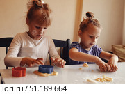 Families Gather in a Cozy Kitchen to Create Delicious Cookies Together. Стоковое фото, фотограф Aleksandr Golubev / Фотобанк Лори