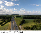Highway a9 crossing Franconian fields with wind turbines in background near pegnitz, Bavaria, Germany. Стоковое фото, фотограф Данил Руденко / Фотобанк Лори