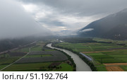 Inn river meandering through cultivated fields in the Alps, Tyrol, Austria. Стоковое фото, фотограф Данил Руденко / Фотобанк Лори
