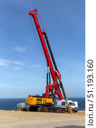 Drilling rig for leader drilling and pile installation. Стоковое фото, фотограф Евгений Ткачёв / Фотобанк Лори