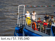 Moscow July 25 2025, boat with a yellow life preserver on the side. Редакционное фото, фотограф Скрипачев Антон / Фотобанк Лори