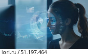 A woman reflects on innovative technology and its potential impact on society while surrounded by a contemporary workspace at dusk. Стоковое AI-видео, аниматор Данила Большаков / Фотобанк Лори