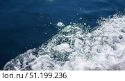 Feel the adrenaline as waves crash against the boat, sending splashes of sea foam into the air. Explore the magnificent Adriatic waters while cruising through the stunning landscape of Montenegro. Стоковое видео, видеограф Юлия Петровская / Фотобанк Лори