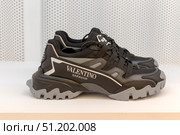 Alentino sneakers in a luxury fashion store showroom. Редакционное фото, фотограф Татьяна Васильева / Фотобанк Лори