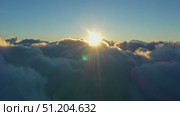 Aerial view of clouds and morning sun. Стоковое видео, видеограф Михаил Коханчиков / Фотобанк Лори