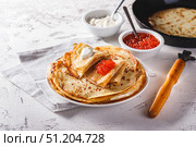 Stack of russian pancakes blini with red caviar, fresh sour cream. Стоковое фото, фотограф Ирина Буракова / Фотобанк Лори