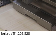 conveyor at a confectionery factory coating wafer plates with chocolate mass and assembling wafers. Стоковое видео, видеограф Алексей Сергеев / Фотобанк Лори