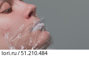 An Innovative and Creative Shaving Technique Using Plastic Wrap for a Unique Aesthetic Look. Стоковое видео, видеограф Olesia Kondrateva / Фотобанк Лори
