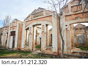 Dagestan, Russia. - January 06, 2024: The destroyed building of the KumTor Kale railway station near the SaryKum dune. Редакционное фото, фотограф Наталия Кирсанова / Фотобанк Лори