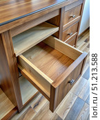 A Partially Open Drawer in a Wooden Cabinet With Shelves. Generative AI. Стоковое AI-изображение, AI-художник Roman Zavorotny / Фотобанк Лори
