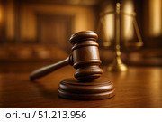 A Detailed Reflection on Justice: A Wooden Gavel and Scales of Justice in an Elegant Courtroom Setting, Symbolizing Law and Order. Стоковое AI-изображение, AI-художник Башкирова Анна / Фотобанк Лори