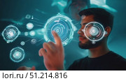 Witness an engaging demonstration of advanced holographic technology as participants interact with digital displays in a cutting-edge facility. Стоковое AI-видео, аниматор Данила Большаков / Фотобанк Лори
