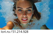 A person creates vibrant splashes while diving into a crystal-clear pool, surrounded by a tropical paradise and bright sunlight. Стоковое AI-видео, аниматор Данила Большаков / Фотобанк Лори