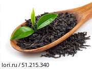 Dry black tea leaves in a wooden spoon isolated on white background. Pile of Dried fermented tea. Black Tea Leaves Heap. Close Up, Macro. Texture. Copy Space. Dried Tea. Abstract Food Drink Backdrop. Стоковое AI-изображение, AI-художник Марина Демидюк / Фотобанк Лори