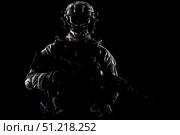 Special operations forces soldier wearing mask, armed with submachine gun, on black background. Oleg Zabielin / Stocktrek Images/TASS. Стоковое фото, агентство ТАСС / Фотобанк Лори