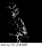 Special forces soldier equipped with night vision device and submachine gun with silencer. Стоковое фото, агентство ТАСС / Фотобанк Лори