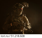 Special forces fighter armed with submachine gun and night vision goggles on helmet. Oleg Zabielin / Stocktrek Images/TASS. Стоковое фото, агентство ТАСС / Фотобанк Лори