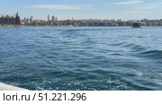 Seagulls Flying Above Bosporus Strait in Istanbul Sailboat and yacht racing in the Bosphorus and the Sea of Marmara Bosphorus Strait in Istanbul, Turkey Beautiful view of the Bosphorus shore on a sunny day, full of residential houses, Istanbul, Turkey. A wide view of the Bosphorus Strait in Istanbul, with the city's skyline and coastal buildings in the background. A ship sails across the calm waters under the clear blue sky. Стоковое видео, видеограф Zita Khasanova / Фотобанк Лори