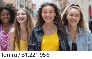Diverse young women strolling urban sidewalk, dressed in stylish summer clothing, laughing together and celebrating close friendship. Стоковое AI-видео, аниматор Юрий Поздников / Фотобанк Лори