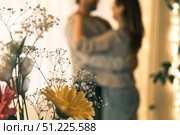 Emotional Dance. Middle-aged Couple Dancing Together Embrace at Home. Mature Couple dancing bonding, smiling and moving to the rhythm in a romantic vibe enjoying their anniversary. Active relationship. Стоковое фото, фотограф Марина Демидюк / Фотобанк Лори