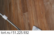 Modern mop washes brown linoleum floors, cleaning concept household chores. Стоковое видео, видеограф Катерина Белякина / Фотобанк Лори