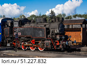 An old Soviet steam locomotive of the L series. The Ruskeala Express retro train is at the Sortavala station. Russia, Republic of Karelia, Sortavala, August 12, 2025. Редакционное фото, фотограф Photojuli / Фотобанк Лори