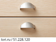 Metal cabinet handle on wooden kitchen cabinet. Original innovative stainless steel door handle. Furniture Doorknob. Interior design. Drawer cup handles cabinets parts. Front view minimalist design. Стоковое AI-изображение, AI-художник Марина Демидюк / Фотобанк Лори