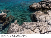 Kalkan wild beach, Turkey. A picturesque view of a rocky coastline (2024 год). Стоковое фото, фотограф EugeneSergeev / Фотобанк Лори