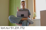 Teen girl school student wear headphones watching online webinar, talking through webcam looking at laptop. Teenager conducting video conference on computer at home, chatting online with friends. 4K. Стоковое видео, видеограф Марина Демидюк / Фотобанк Лори