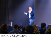Public speaker addressing a large audience in a conference setting. Стоковое фото, фотограф Антон Гвоздиков / Фотобанк Лори
