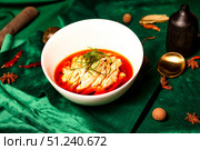 Saliva Chicken in a White Bowl Displayed on Emerald Fabric. Стоковое фото, фотограф Aleksandr Golubev / Фотобанк Лори