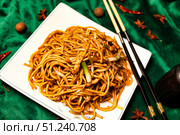 Noodles in a Square Plate With Spicy Ingredients Awaits Hungry Diner. Стоковое фото, фотограф Aleksandr Golubev / Фотобанк Лори