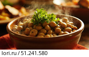 Steaming bowl of seasoned butter beans garnished with fresh parsley. Стоковое фото, фотограф David Kashakhi / Фотобанк Лори