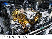 Car repair: type of open engine with drive chains and a large number of pulleys and parts. Стоковое фото, фотограф Енваев Андрей / Фотобанк Лори