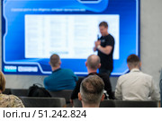 Speaker having discussion during business presentation with audience in conference room. Стоковое фото, фотограф Антон Гвоздиков / Фотобанк Лори
