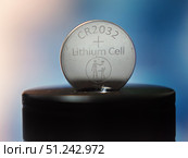 Lithium CR2032 Cell Battery on Cap Background. Редакционное фото, фотограф Sergakoff / Фотобанк Лори