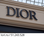 Dior Brand Logo Display at Luxury Storefront. Редакционное фото, фотограф Sergakoff / Фотобанк Лори