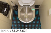 This is a Unique and Innovative Stainless Steel Toilet Design in a Contemporary Modern Restroom. An intriguing view of a sleek stainless steel toilet that showcases modern restroom design elements. Стоковое видео, видеограф worker / Фотобанк Лори