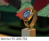 Elegant Gold Rolex Submariner Watch Displayed in Boutique. Редакционное фото, фотограф Sergakoff / Фотобанк Лори