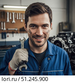 Profession auto mechanic - portrait of a man with a wrench. AI generated. Стоковое AI-изображение, AI-художник Андрей Аркуша / Фотобанк Лори