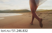Female silhouette running alone on empty beach at sunset. Barefoot steps on soft sand, gentle ocean beside. Symbol of solitude, inspiration, mindful escape and inner peace. Sense of freedom. Стоковое видео, видеограф Енваев Андрей / Фотобанк Лори