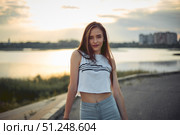 Young beautiful caucasian blonde girl listening to music with smartphone walking and dance in the city with headphones smiling - relax, youth, emancipation concept. Стоковое фото, фотограф Арзюков Вадим Николаевич / Фотобанк Лори