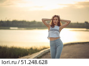 Young beautiful caucasian blonde girl listening to music with smartphone walking and dance in the city with headphones smiling - relax, youth, emancipation concept. Стоковое фото, фотограф Арзюков Вадим Николаевич / Фотобанк Лори