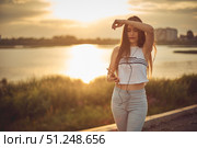 Young beautiful caucasian girl listening to music with smartphone walking in the city with headphones smiling - relax, youth, emancipation concept. Стоковое фото, фотограф Арзюков Вадим Николаевич / Фотобанк Лори
