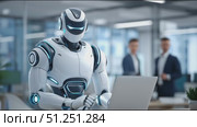Futuristic humanoid robot with sleek design is working on a laptop in a modern office environment, showcasing advanced technology and collaboration with human colleagues. Стоковое AI-видео, аниматор Ирина Ручушкина / Фотобанк Лори